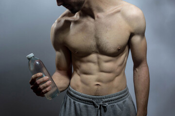 A young shirtless muscluar man