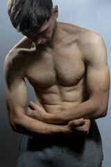 Naklejka premium A young shirtless muscluar man