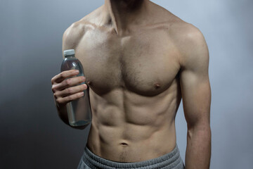 A young shirtless muscluar man