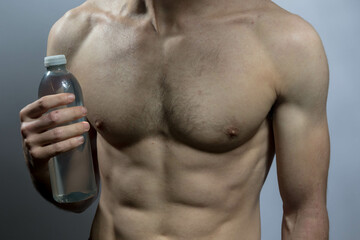 A young shirtless muscluar man