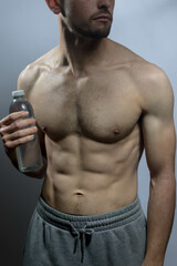 Fototapeta premium A young shirtless muscluar man