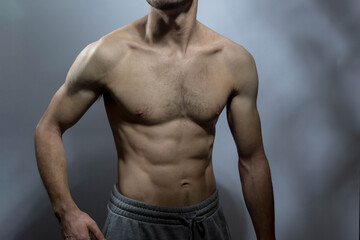Fototapeta premium A young shirtless muscluar man