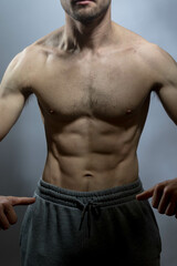 A young shirtless muscluar man