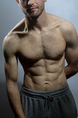 Fototapeta premium A young shirtless muscluar man