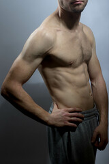 Obraz premium A young shirtless muscluar man