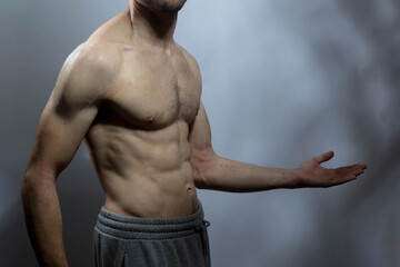 A young shirtless muscluar man