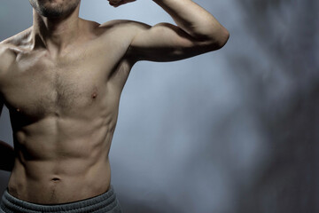 A young shirtless muscluar man