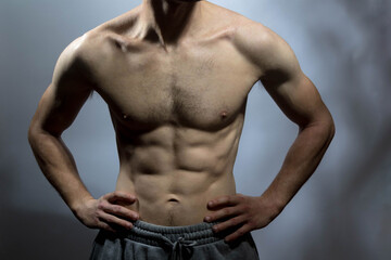 Obraz premium A young shirtless muscluar man