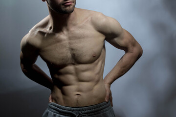 Fototapeta premium A young shirtless muscluar man