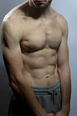 Fototapeta premium A young shirtless muscluar man