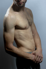 Obraz premium A young shirtless muscluar man