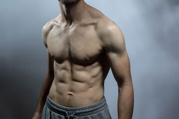 A young shirtless muscluar man