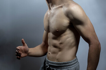 A young shirtless muscluar man