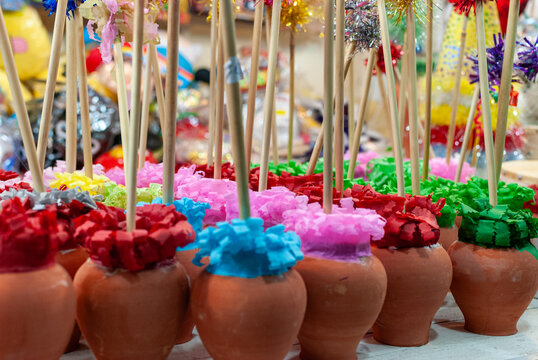 Colorful Zambombas in a Market Stall
