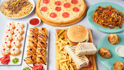 Different dishes - pizza, burger, manti, lagman, doner, sushi. Top view on a light background