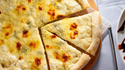 Pizza slices flying, isolated on white background. Delicious cheese pizza slices. Italian style pizza slices.