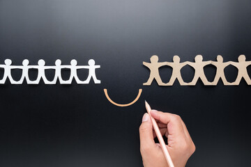 Closeup hand drawing a line to connect the two different teams, partnership, collaboration concept