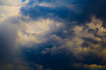 White-blue clouds in the sky close-up blurred focus, bluer