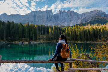 Exploring the serene beauty of the Dolomites with a picturesque lake and majestic mountains