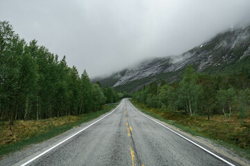 Empty road in a moody norway mountain landscape