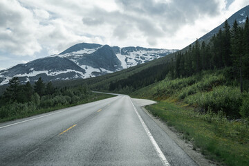 Empty road in a moody norway mountain landscape
