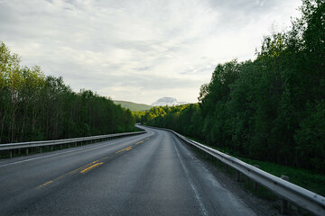 Empty road in a moody norway mountain landscape