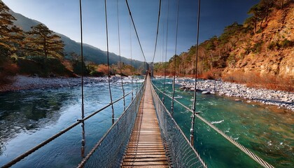 Fototapeta premium Puente colgante, sobre un río de aguas cristalinas