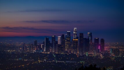 Obraz premium Stunning Twilight View of the Los Angeles Skyline: This Captivating Image Showcases the City’s Iconic Skyscrapers Bathed in the Warm Glow of Sunset, Set Against a Dramatic Sky