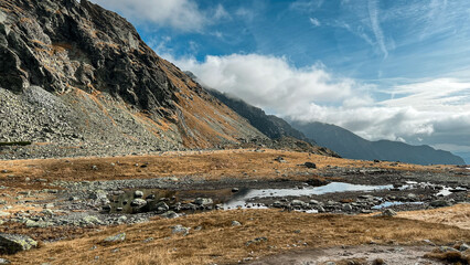 Beautiful mountain landscape with a lake and cloudy fall weather 