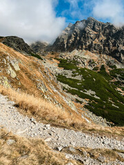 Beautiful foggy hill of the High Tatras with rocky terrain and steep cliffs