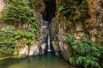 Salto do Cabrito Waterfall in Azores with Rocky Cliffs and Verdant Foliage - Serene Natural Pool and Tropical Vegetation - Ideal for Nature Prints, Digital Backgrounds