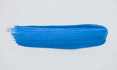 Fototapeta premium Blue acrylic paint applied smoothly on craft paper