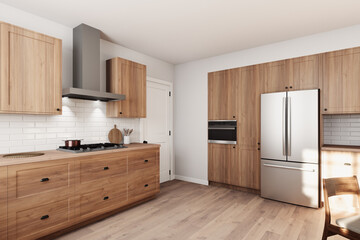 A beautifully designed modern minimalist kitchen with stylish wood cabinets and top appliances