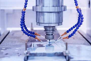 Working closeup CNC turning cutting metal Industry machine iron tools with splash cutting fluid...