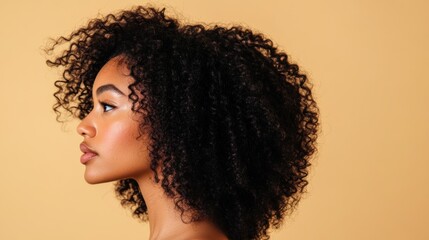 close-up, portrait of a young beautiful girl model with curly hair on a beige background, copy space