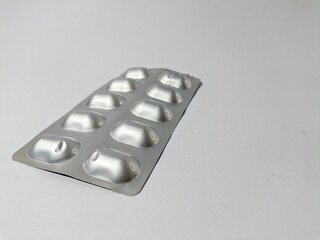 Medicine pills in aluminum foil blister pack isolated on white background, medicine and health...