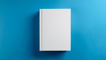 Blank white hardcover book mockup on blue background. 3D Rendering