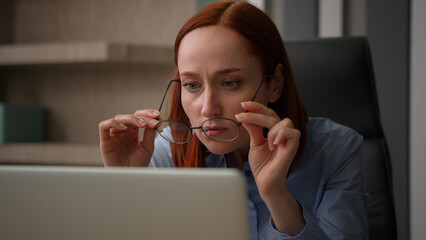 Caucasian businesswoman in office work with computer business woman girl female worker sit at desk...