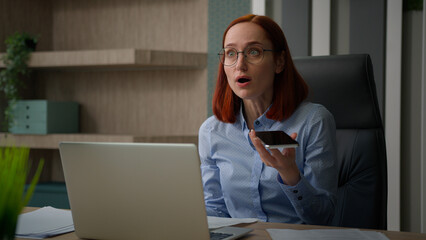 Dissatisfied stressed angry businesswoman office worker woman with laptop and papers mad aggressive...