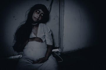 Portrait of asian woman make up pregnant ghost.,Scary horror scene for background,Halloween...