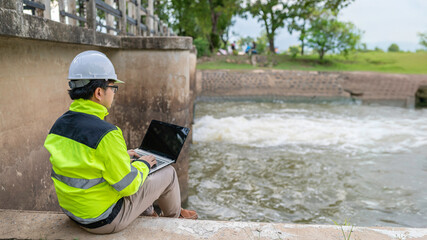 A engineering doing his checking routine. He is wearing hard hat and engineer uniform.Standing by...
