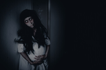 Portrait of asian woman make up pregnant ghost.,Scary horror scene for background,Halloween...