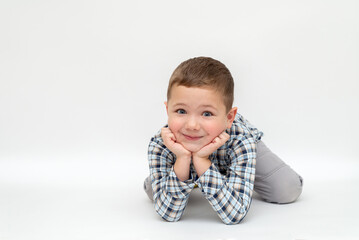 portrait of a child on a white background with space for text. portrait of a little blond boy with light skin 5 years old