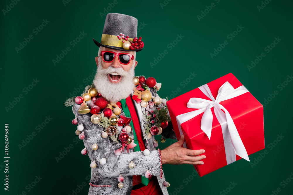 Canvas Prints Photo of cheerful elderly aristocrat hold gift cylinder hat xmas tree toys blazer isolated on dark green color background