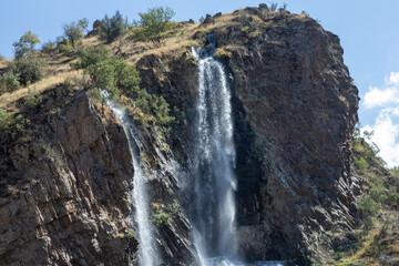 Obraz premium waterfall in the Mediterranean. waterfall in rocky area. Waterfall view.mountain waterfall