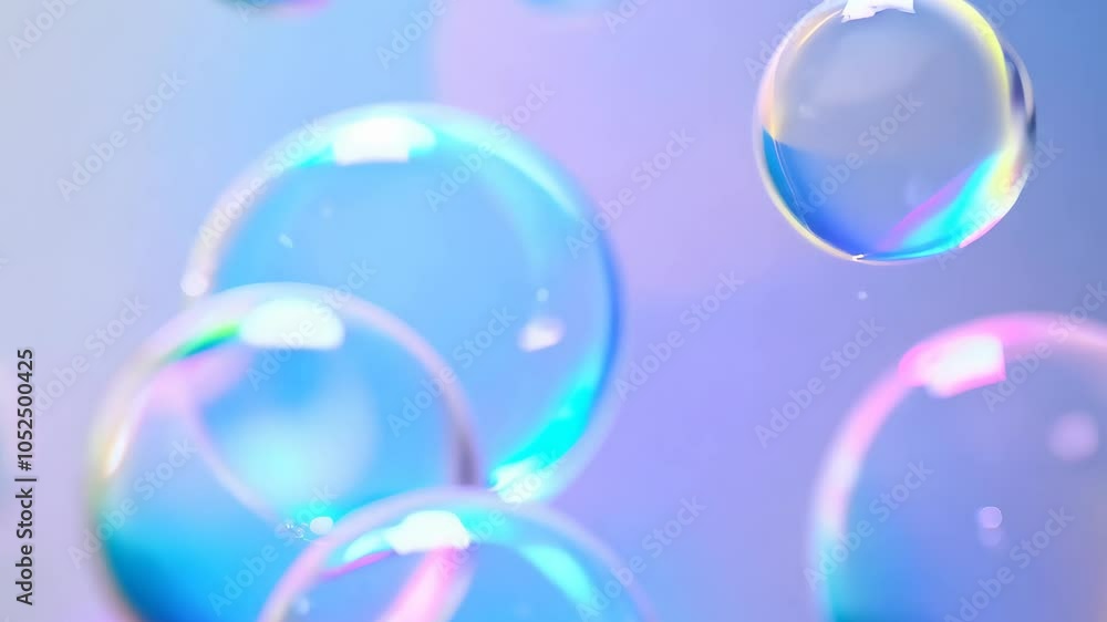Poster cluster of soap bubbles floating in blue and pink light with rainbow sparkle.
