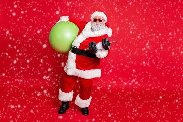 Full length body size view of nice attractive cheerful content fat bearded man working out doing physical exercise diet calories burn pilates workout isolated on bright vivid shine red background