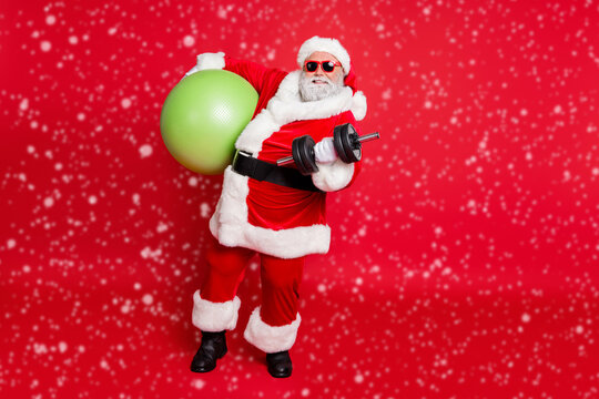 Full length body size view of nice attractive cheerful content fat bearded man working out doing physical exercise diet calories burn pilates workout isolated on bright vivid shine red background