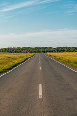 an empty road at sunset in the Orenburg region