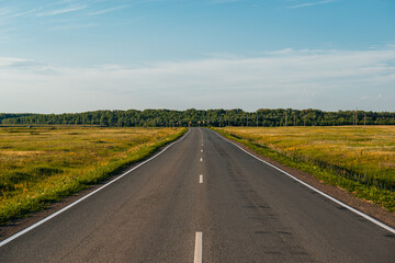 an empty road at sunset in the Orenburg region